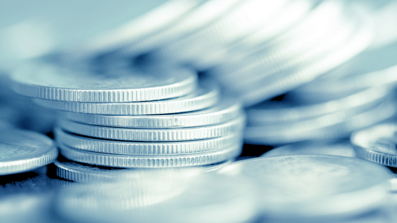 Rows of coins on the table for finance and Saving concept,Investment, Economy, Soft focus and dark style. Image Credit: Adobe Stock Images/Chunnapa