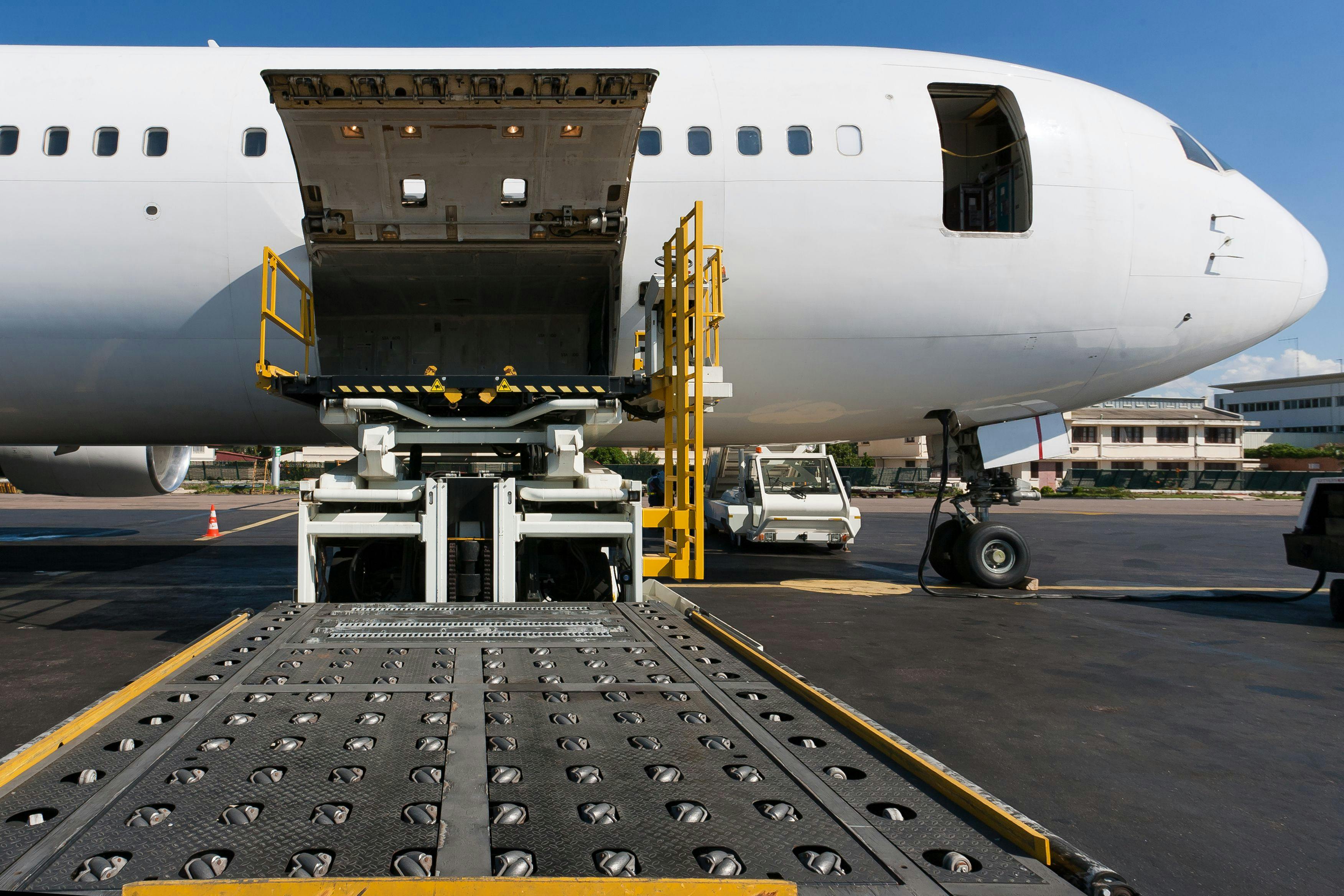 Loading cargo plane. Image Credit: Adobe Stock Images/Pierre-Yves Babelon