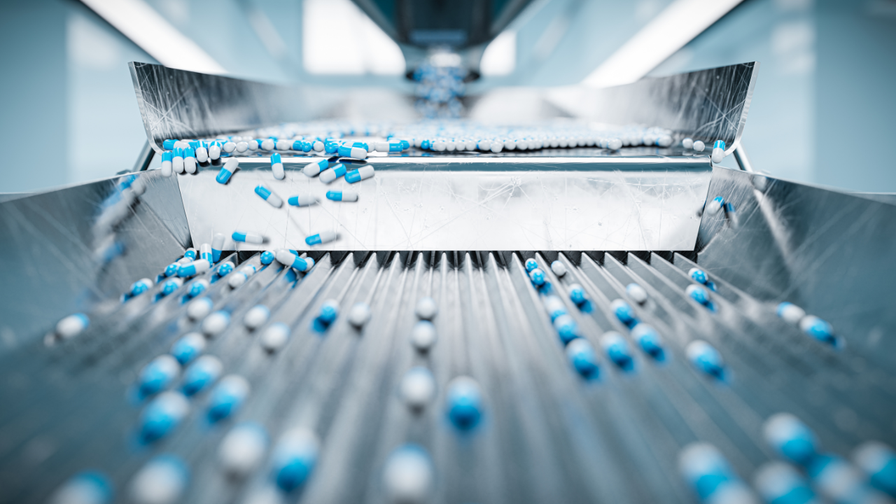 Sorting pharmaceutical capsules by a sorting machine on a production line. Image Credit: Adobe Stock Images/guteksk7