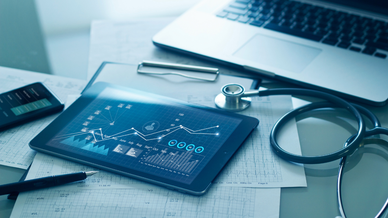Healthcare business concept, Medical examination and graph data growth of business on tablet with doctor's health report clipboard on background. Image Credit: Adobe Stock Images/ipopba