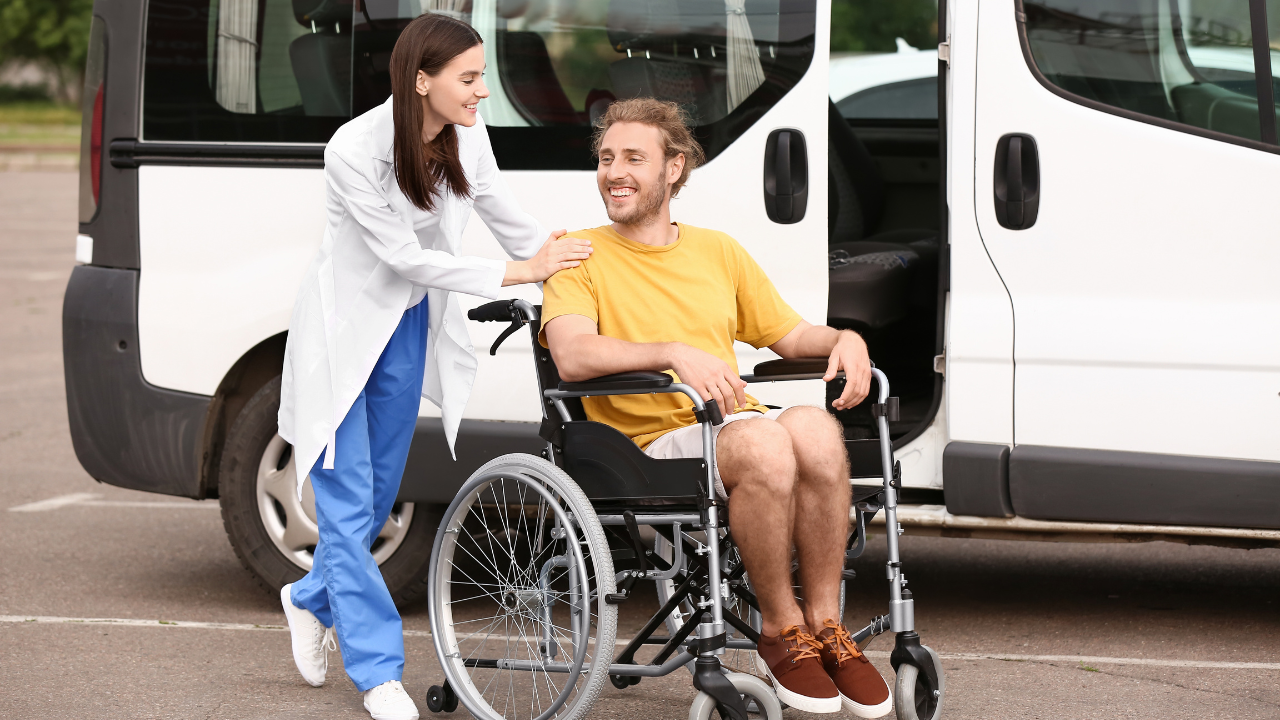 Doctor and handicapped man near car outdoors. Image Credit: Adobe Stock Images/Pixel-Shot