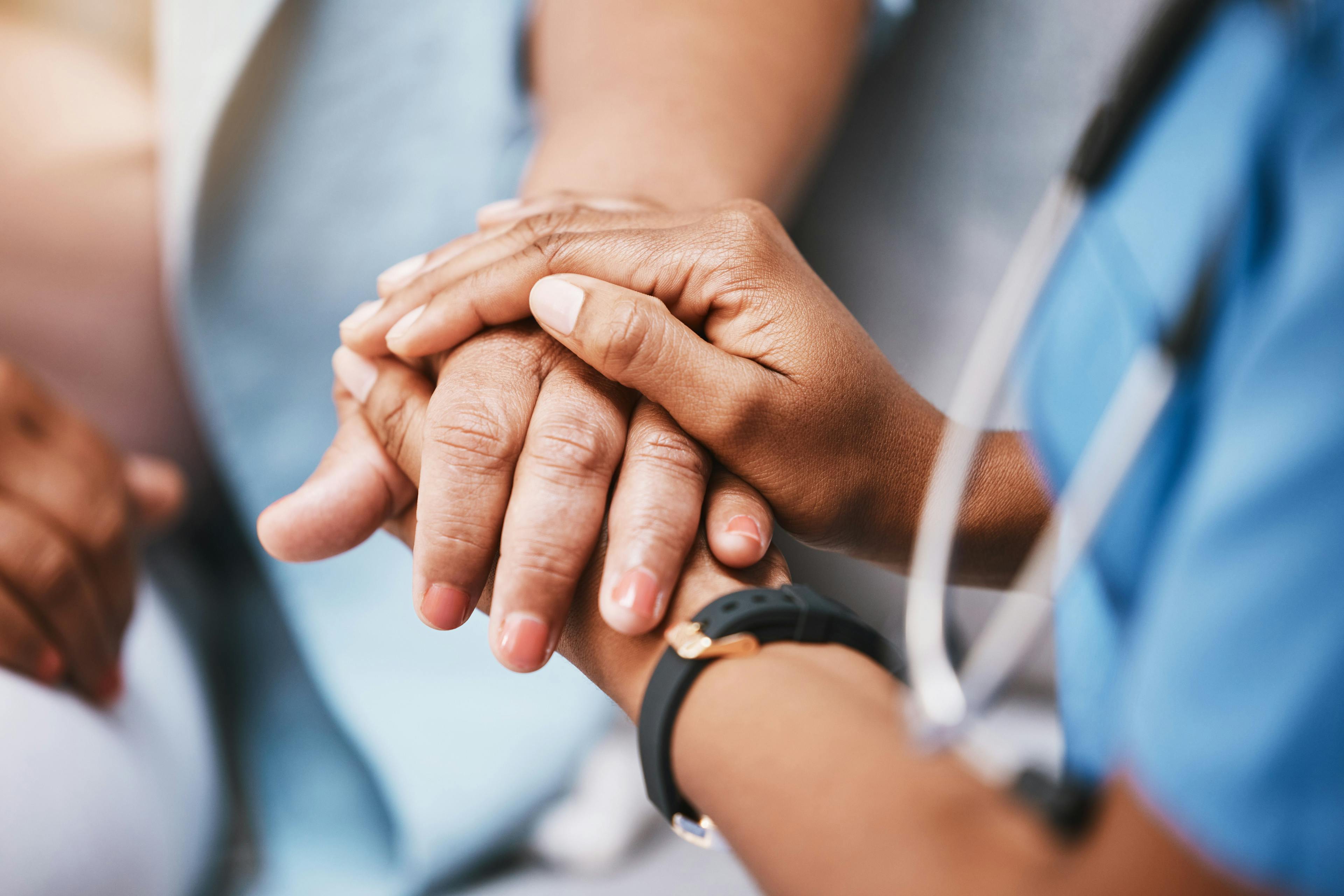 Empathy, trust and nurse holding hands with patient for help, consulting support and healthcare advice. Kindness, counseling and medical therapy in nursing home for hope, consultation and psychology. Image Credit" Adobe Stock Images/C Davids/peopleimages.com