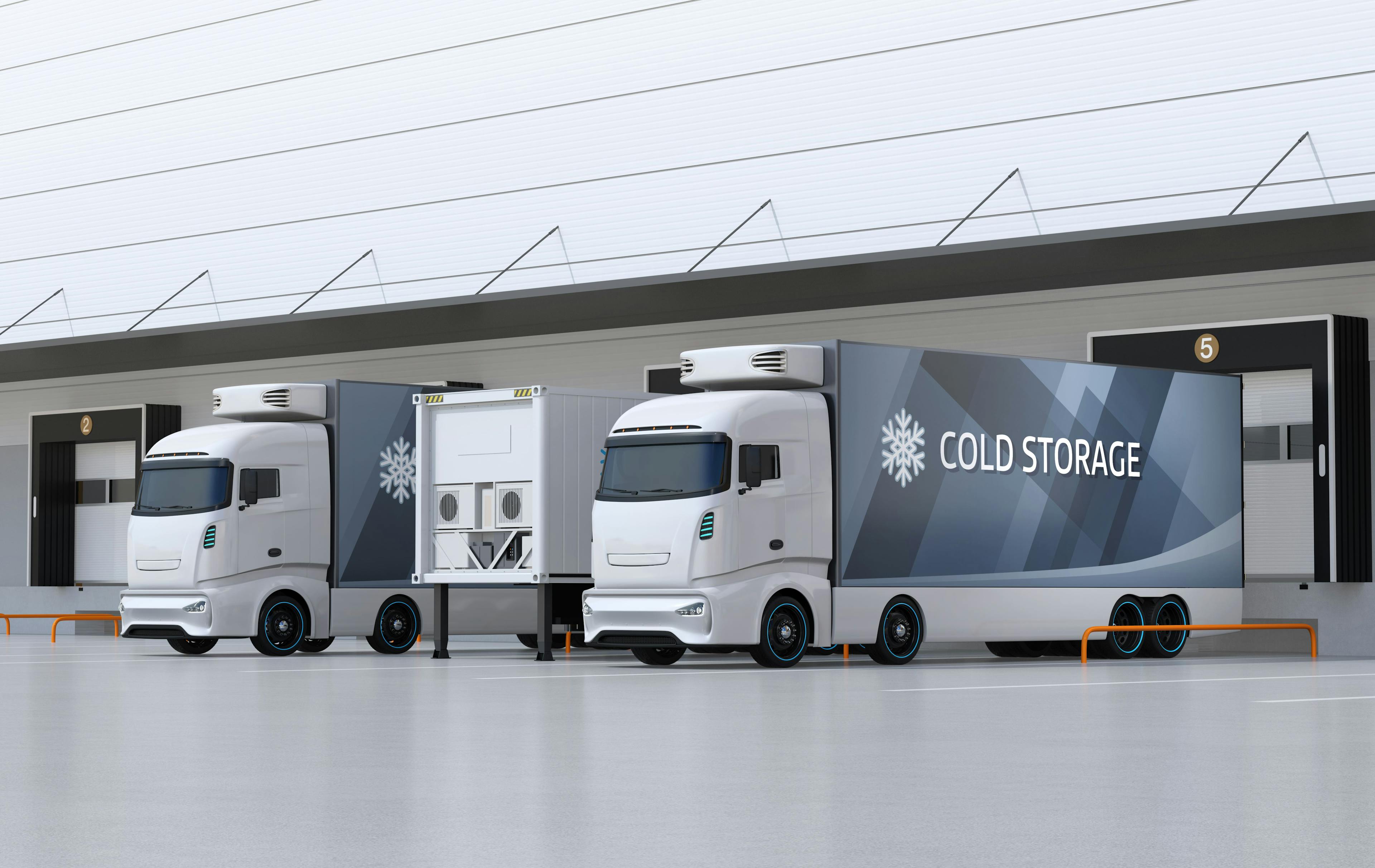 White electric trucks with reefer container and single container trailer parking in logistics center: © chesky - stock.adobe.com