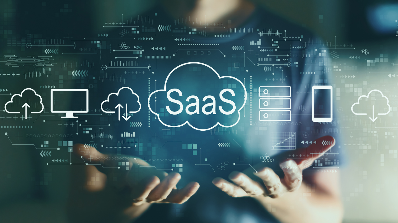 SaaS - software as a service concept with young man in the night. Image Credit: Adobe Stock Images/Tierney